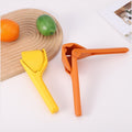 Manual citrus juicer in yellow and orange