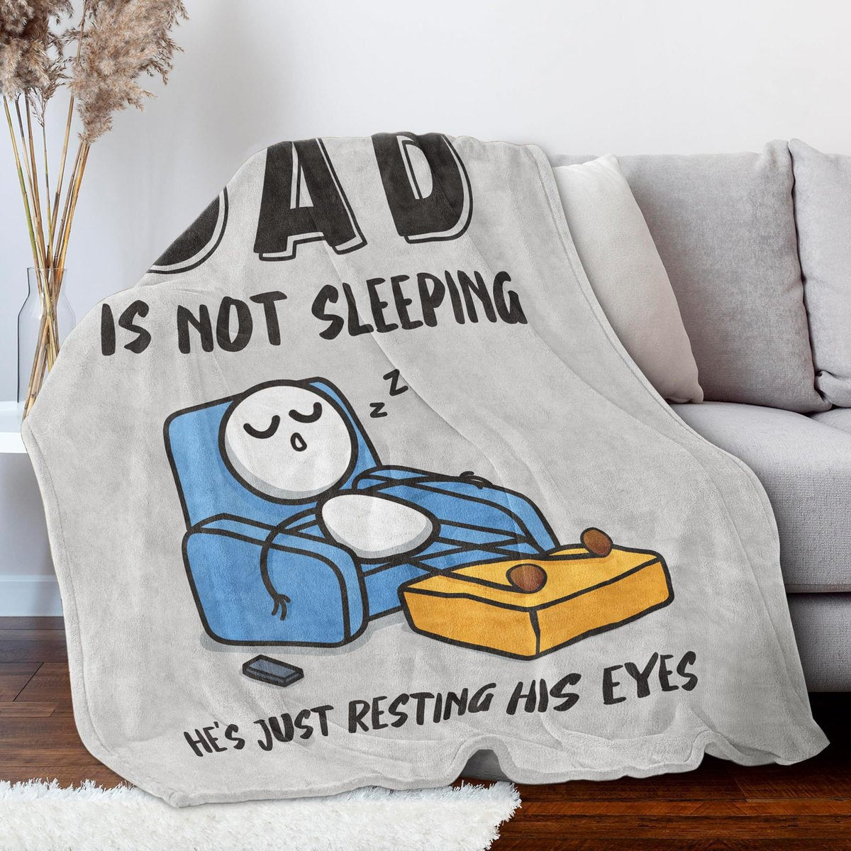 Gray Dad resting eyes blanket on couch