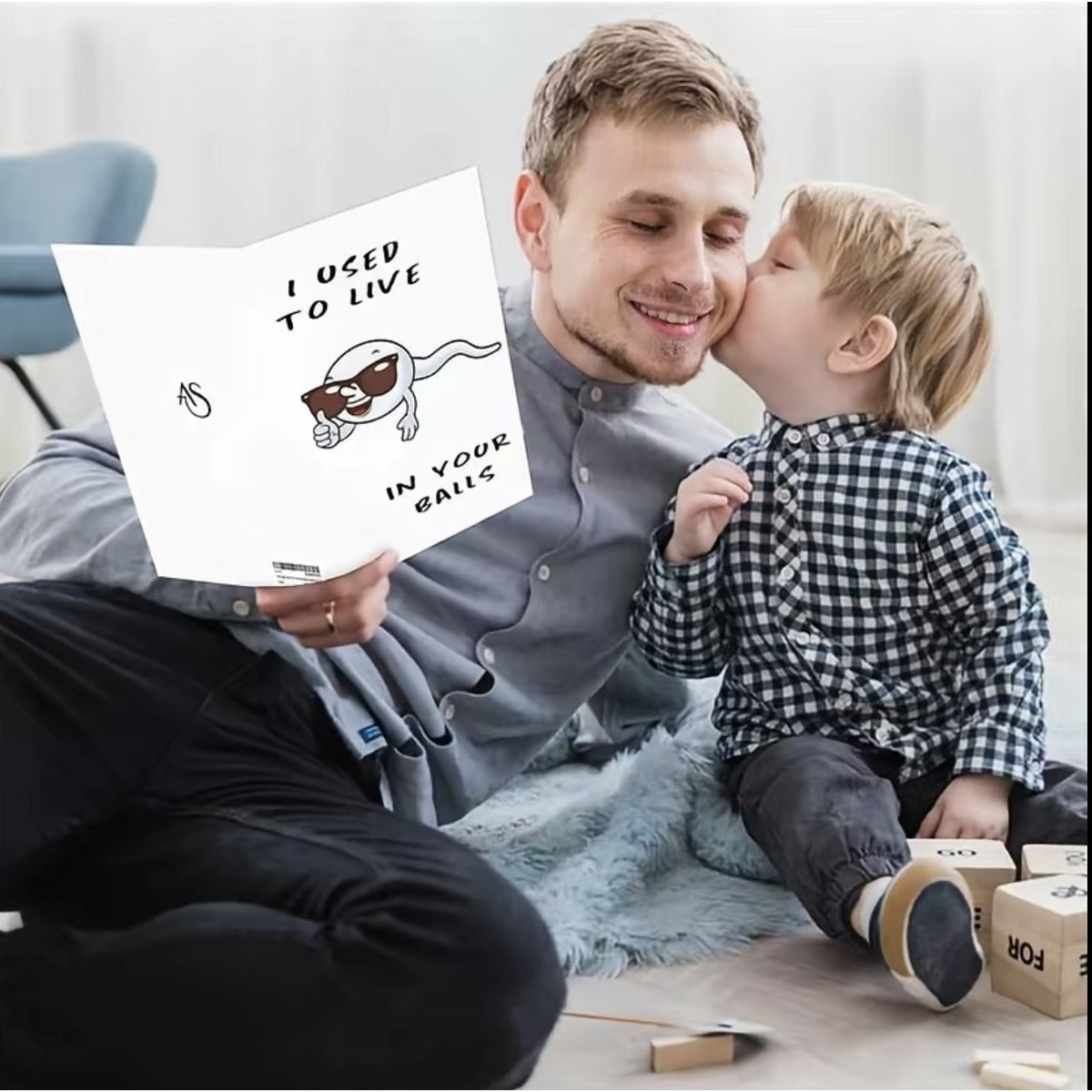 Father and child lifestyle scene holding the funny Father's Day card
