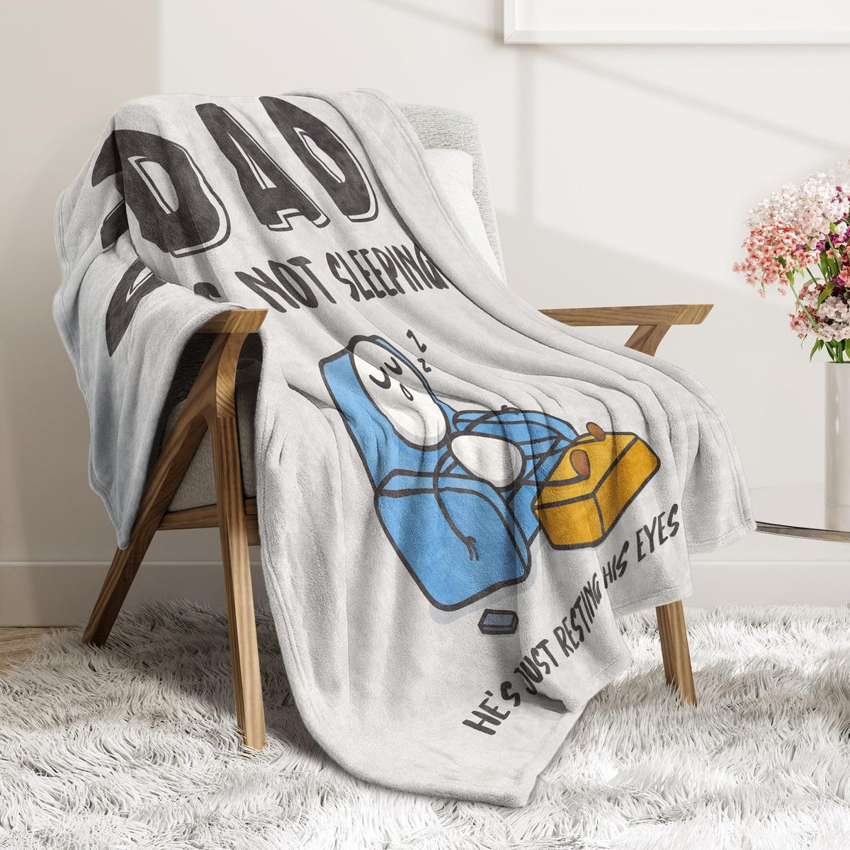 Gray Dad resting eyes blanket on chair