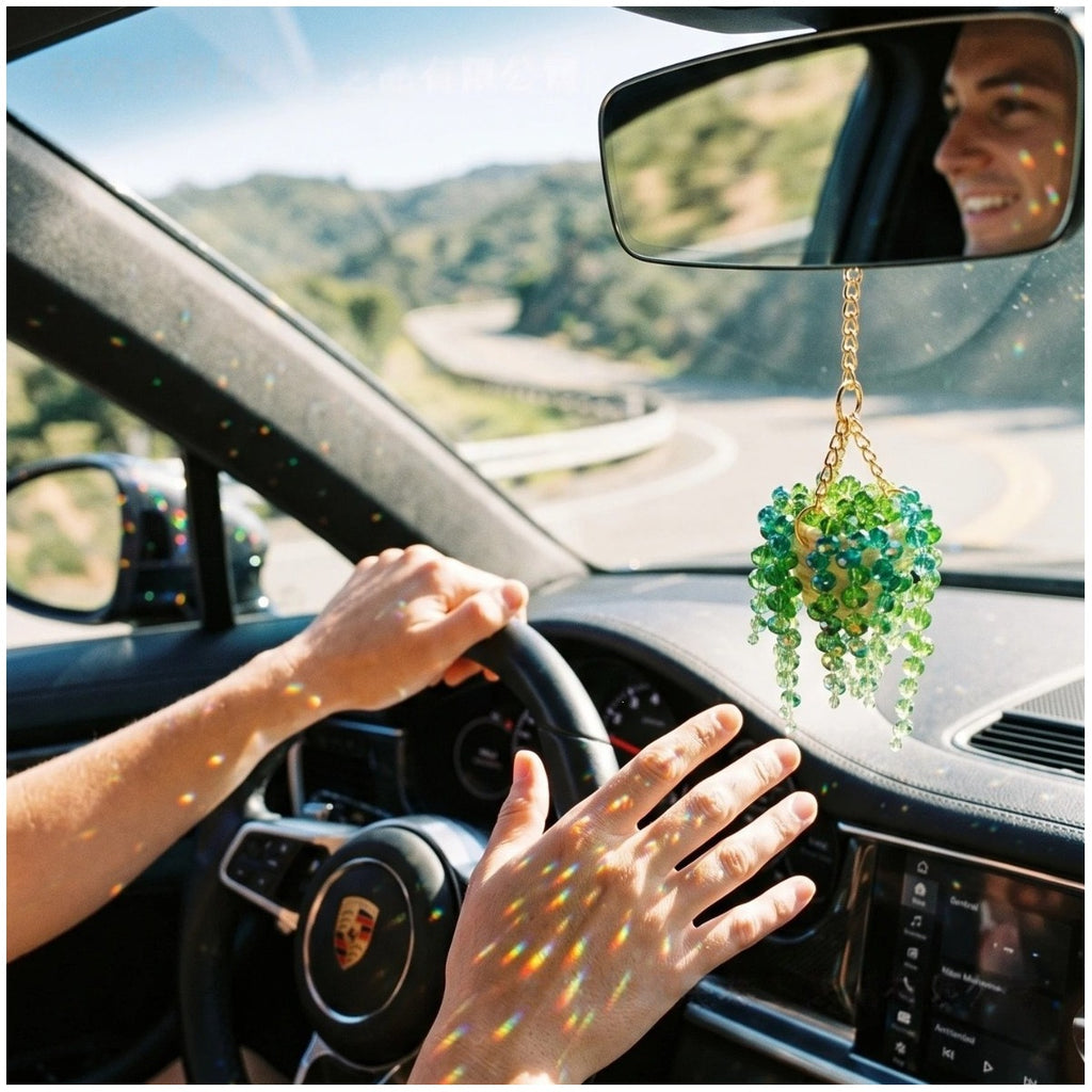 Succulent bead charm hanging inside a car interior