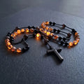 Collier croix Eclat Mystique en obsidienne et yooperlite réactive aux UV