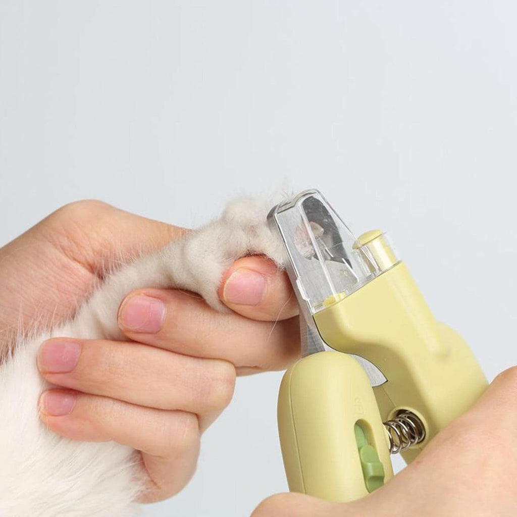 Dog nail clipper with UV LED light for safe trimming and protection against over-cutting. Cute pet claw trimmer and grooming tool for small animals such as dogs, cats, puppies, and kittens.